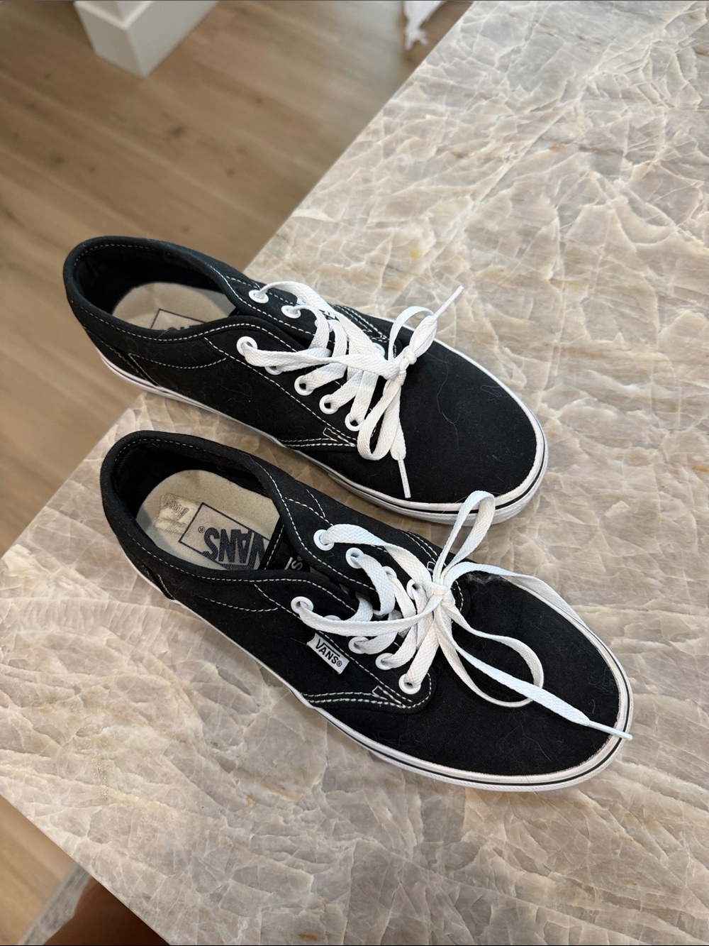 Vans women’s Black Canvas Low-Top Sneakers with White Laces